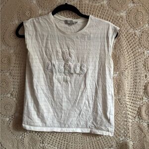 Christian Dior muscle tee. Size 12 kids but fits up to a medium women’s.